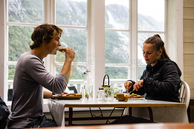 Ida Nilsen and Kyrre Buxrud trying the local food near Langfoss waterfall.  Åkrafjorden  Hordaland  Norway.
